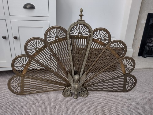 Antique peackock griffin fire